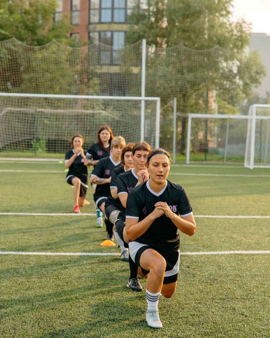 A training group running through a session on a pitch